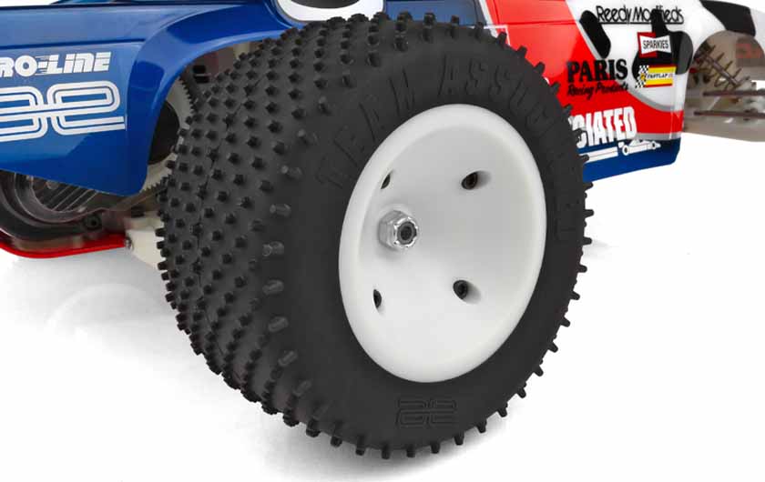 Wide rear tires are pre mounted on white wheels